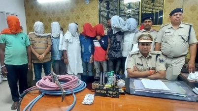 The 8 men (with hoods over their heads) suspected of the bridge theft.